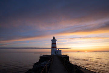Lighthouse at Gardur, Iceland. Evening at Gardur, Iceland, at sunset. Gardur is in southwest...