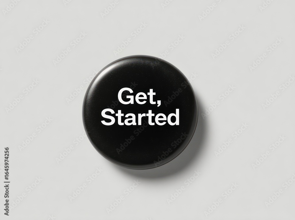 Poster a close-up shot of a circular black button featuring the phrase 