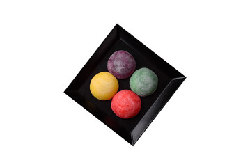 Japanese mochi, ice cream or Asian sweets with fruit filling. Mochi of different colors