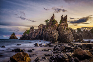Dramatic Coastal Landscape with Rugged Rock Formations at Sunset