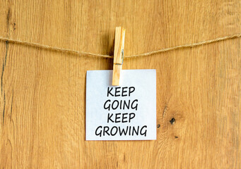 Keep going and growing symbol. Concept words phrase Keep going keep growing on beautiful white...