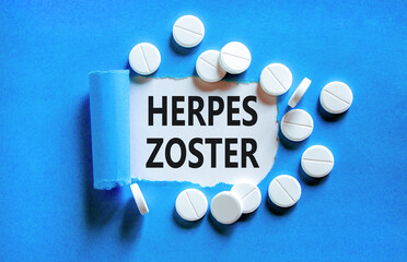 Herpes zoster symbol. Concept words Herpes zoster on beautiful white paper. White pills tablets....