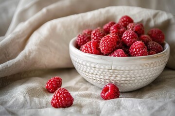 Fresh raspberries in rustic white bowl
