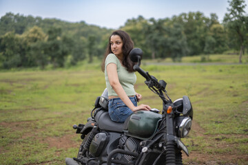 Strong independent Indian woman biker: beautiful girl, stylish rider, motorcycle adventure, elegant...