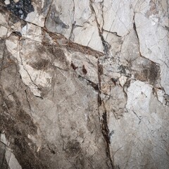 Close-up of a stone surface with cracks and variations in color