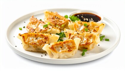 White plate with five golden‑brown pan‑fried dumplings, topped with green onions and black sesame seeds