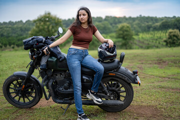 Strong independent Indian woman biker: beautiful girl, stylish rider, motorcycle adventure, elegant...