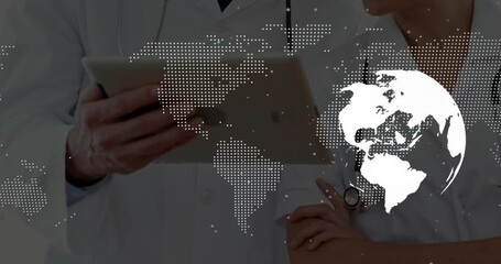 world map and globe overlay fading revealing two doctors pointing at tablet data collaborating - Powered by Adobe