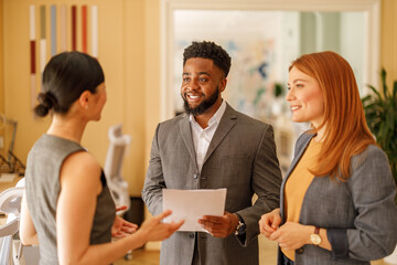Accountants analyzing and discussing financial reports with partners while working in corporate...