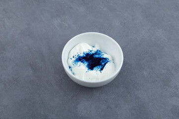 Blue fat-soluble dye particles dissolves in buttercream. Brilliant blue FCF or Triarylmethane, dye...