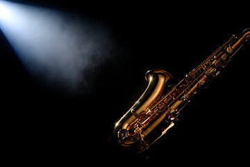 A close up dramatic shot of a golden saxophone illuminated by a bright spotlight against a dark moody background evoking a sense of jazz music and performance