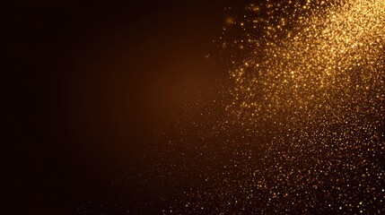 Abstract golden glitter explosion on dark background