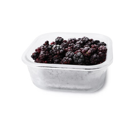 Frozen blackberries in glass container isolated on white