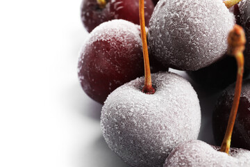 Many frozen cherries on white background, closeup