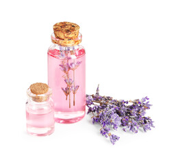Lavender essential oil in bottles with flowers isolated on white