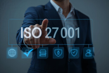 Business professional points to iso 27001 certification with security icons