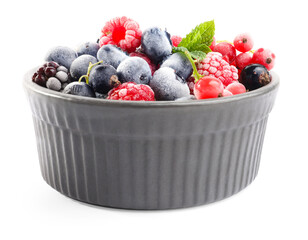 Many different frozen berries and mint in isolated on white