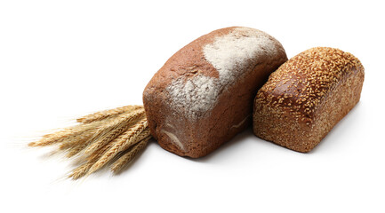 Loaves of fresh bread and spikes on white background