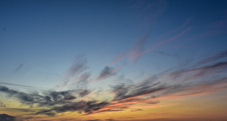 Vibrant evening sky with airy sunset clouds
