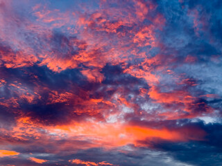 Twilight cloudscape, with high clouds tinged just after sunset, summer in southwest Florida. Digital oil-painting effect. For background or element with motif of transition.