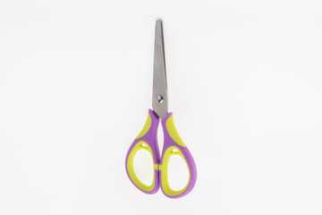Scissors resting against a white background