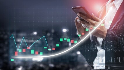 A focused business professional reviews stock market trends using a smartphone, surrounded by abstract graphs and data visualization against a cityscape backdrop. Copula