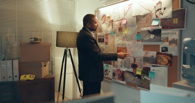 Man, crime board or night with private investigation for murder scene or tracking suspect in office. Male person, officer or detective working late with map for evidence or information on killer