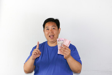 Rich asian guy showing money to camera