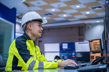 Engineer working at control room, Manager control system, Technician man monitoring program from a...