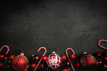 Christmas and New Year background with a festive scene with gold and red Christmas ornaments and...