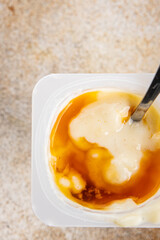 Rice pudding caramel syrup sweet dessert snack fresh delicious gourmet food background on the table rustic food top view copy space