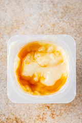 Rice pudding caramel syrup sweet dessert snack fresh delicious gourmet food background on the table rustic food top view copy space