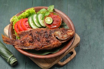 Ikan Nila Bakar. Grilled tilapia fish is a variation of grilled fish that uses tilapia as the main...