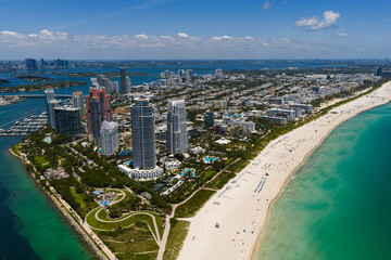 Obraz premium Top view of South Miami Beach. Scenic drone view of Miamis famous coastline. Miami Beach skyline with skyscrapers. Aerial view of Miami Beach in summer. Miami Beach shore with skyscrapers.