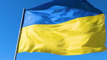 Ukrainian Flag Waving Against Blue Sky - Powered by Adobe