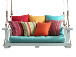 Rustic white wooden porch swing with colorful striped and solid pillows suspended by thick jute ropes.