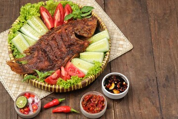 Ikan Nila Bakar. Grilled tilapia fish is a variation of grilled fish that uses tilapia as the main ingredient