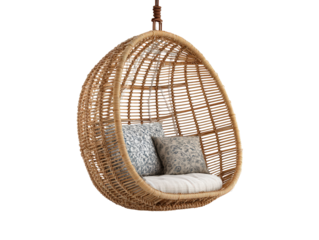 Woven rattan hanging egg chair with a cocoon shape striped seat cushion and decorative floral pillows.