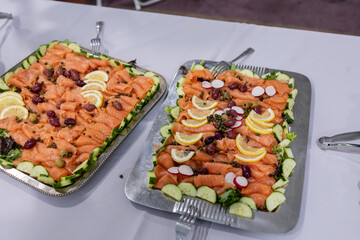 platters of smoked salmon with various garnishes on table at bat mitzvah luncheon
