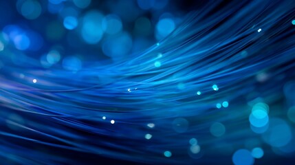 Wavy blue optic fibers flowing with bokeh background, conveying fast data transfer