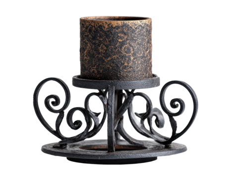 Ornate black wrought iron candle holder with scrollwork and a rustic mottled pillar candle.