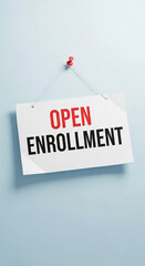 Photo of sign hanging on a wall announcing open enrollment for health insurance and employee benefits