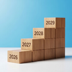 Photo of wooden blocks stacked in a staircase formation symbolizing growth and success in the coming years from 2026 to 2029