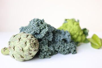 Fresh organic vegetables on a light background. 