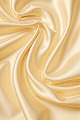 Fototapeta premium yellow golden silk satin fabric background