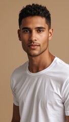 Portrait of a confident young man in a white t-shirt against a beige background