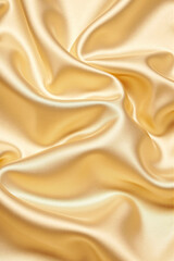 Obraz premium yellow golden silk satin fabric background