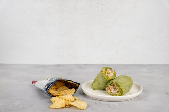 Healthy turkey wrap with potato chips 