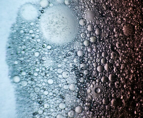 Abstract close-up of oil and water bubbles with gradient lighting