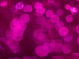 Abstract pink bokeh lights background with soft glowing circles